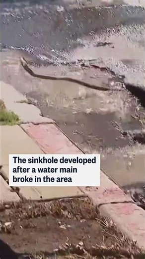 Giant sinkhole partially swallows Spectrum van
