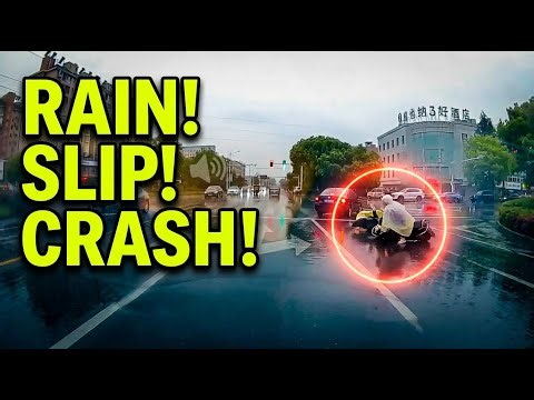 Scooter rider slips and falls in rainy road incident in Danyang, Jiangsu, China