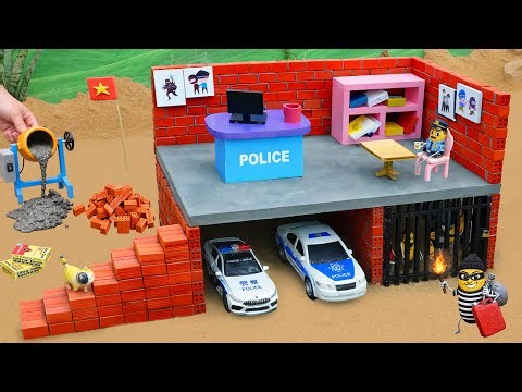 DIY mini tractor science project: Building a fireproof police station and prison out of brick