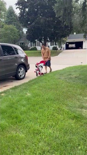 Toddler Falls Asleep Riding Tricycle On Driveway