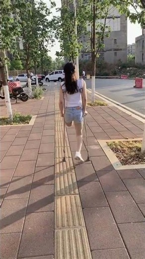 Ayla SAK amputee walking outside with one leg using crutches #amputee #sak