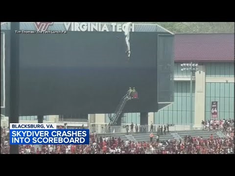 Skydiver rescued after crashing into scoreboard, dangles from parachute at Virginia Tech