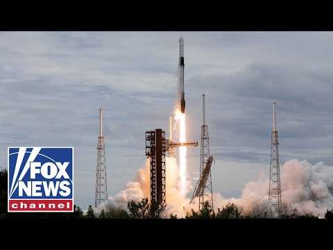 MISSION MILESTONE: SpaceX Dragon capsule docks at the International Space Station