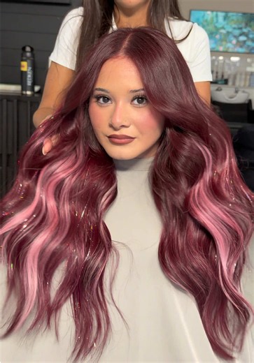 PINK VELVET 🩷✨ special transformation on my bb @xolaur1ta using @Redken for that perfect red and @inhprofessional hair for the gorgeous pairing with the hair tinsel ⭐️ What color should we do next?! — #redken #redkenpro #inhprofessional