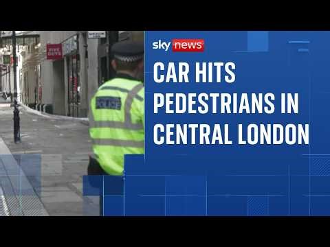 Woman arrested after car hits three pedestrians