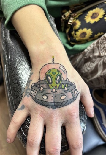 Intriguing Alien Hand Tattoo Design
