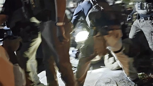 Angry Scenes as Man Pinned to Ground Outside Detention Center