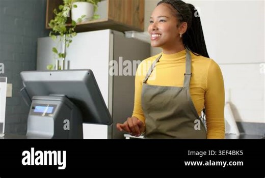 Cashier using POS terminal in cafe gesturing at QR code as customer scanning smartphone to pay. Digital transaction, point of sale, contactless payment, mobile payment, hospitality, retail Stock Video Footage - Alamy