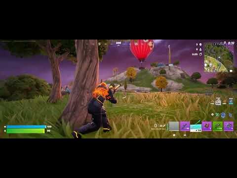 Eliminating the alien with the Boom Sniper Rifle in Fortnite.