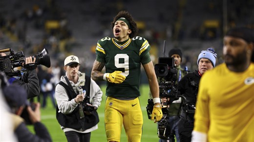Christian Watson spat up blood, broke a rib, went to the hospital and returned to the game