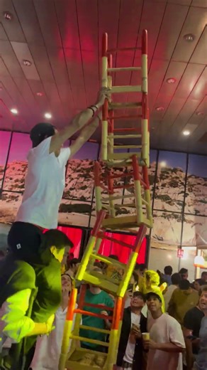 Chair Tower Collapses and Party Guests Fall During Celebration