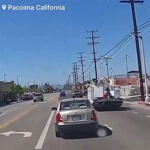 🚨#BREAKING: Watch as dramatic dashboard footage captures a plane slamming into power lines triggering a large explosion.📌#Pacoima | #CaliforniaWatch as a small plane crashes into power lines in Pacoima, California, sparking a fiery explosion and a dangerous electrical hazard. Officials say a 72-year-old man was piloting the aircraft and was rushed to the hospital in critical condition. In the immediate aftermath, bystanders at a nearby O’Reilly Auto Parts parking lot sprang into action about a