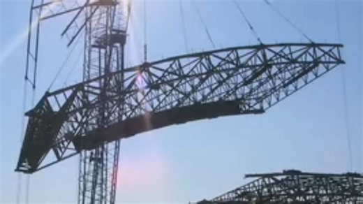 A giant crane was lifting a stadium roof - seconds later, its collapse was caught on camera