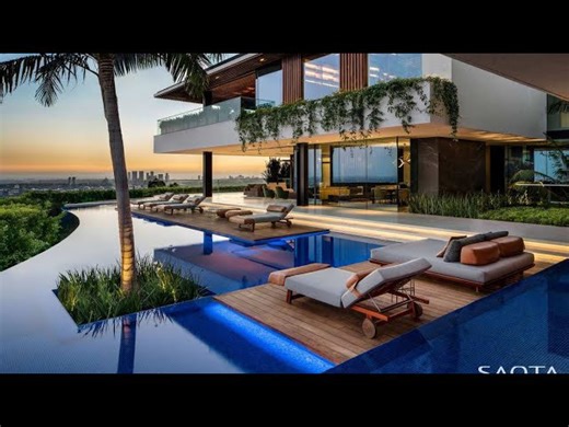 The magnificent hillside residence has a beautiful view of the Los Angeles skyline