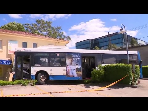 Bus crashes into building after SUV runs red light in Sydney’s north