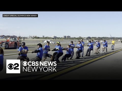 Teams pull airplane for Special Olympics event at Newark Airport