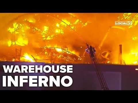 Employee charged with arson after allegedly sparking massive fire at paper goods warehouse