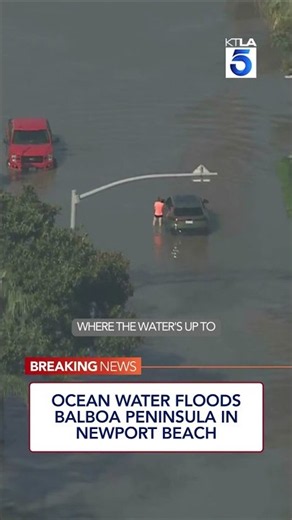 Ocean water floods Balboa Peninsula in Newport Beach