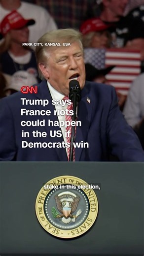 President Trump tells supporters in Kansas that unrest in France is a warning of what could happen in the US if Democrats win, blaming immigration and
