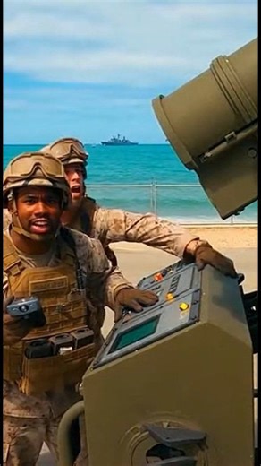 A US marine accidentally launches a missile from a mobile launcher at a coastal base. The rocket backfires, exploding mid-air with massive smoke and fire, sending nearby soldiers scrambling for cover as the camera shakes and chaos ensues. | Military Innovation