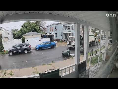 Garbage Truck Knocks Over Trash Bins and Drives Off