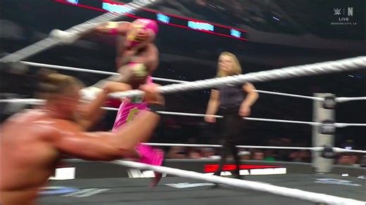 Rey Mysterio pinning Big Cass — quick WWE win with Dragon Lee assist