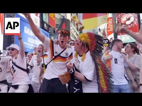 Germany and Ecuador fans fill Times Square with flags, drums and music