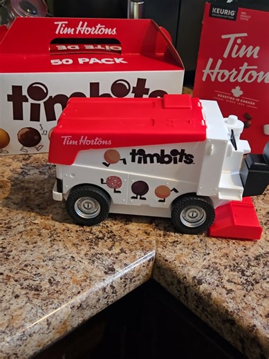 My sons face absolutely lit right up when I handed him his Zamboni filled with Timbits! I've never been happier to spend the last of my Tim's Gifts cards on something so awesomely Canadian. Go get one before they are gone!! @Tim Hortons This is officially the coolest thing you guys have come out with!! Our entire family was smiling, and our son didnt want to share! 😄🇨🇦 #timhortons #timhortonscanada #zamboni #timbits #canadianmom