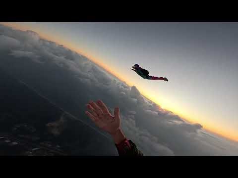 Skydivers Perform Synchronized Acrobatics During Sunset Freefall