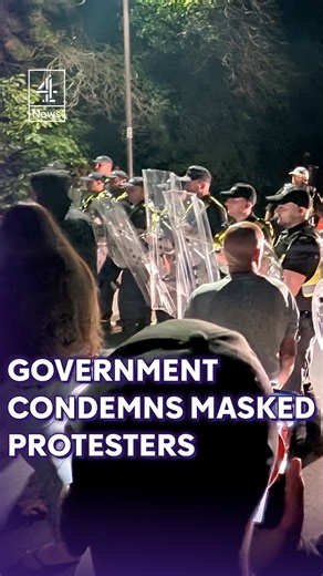 Government condemns "intimidating and thuggish" masked protesters