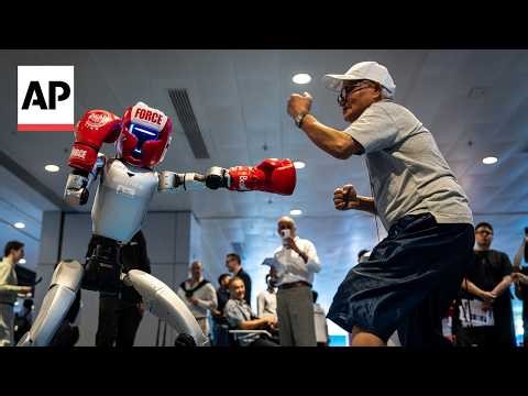 Humanoid robots show off language and boxing skills at Hong Kong exhibit