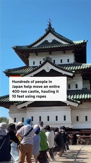 Crowds move Japanese castle by hand