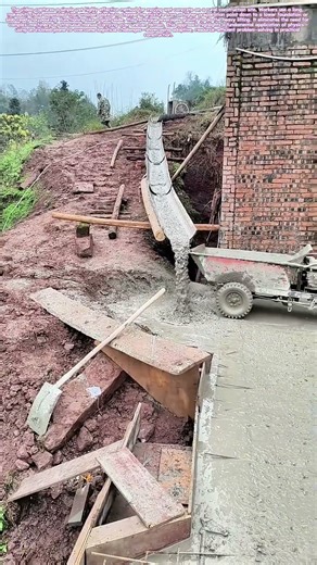 Gravity's Conduit: The Wooden Chute Concrete Pour