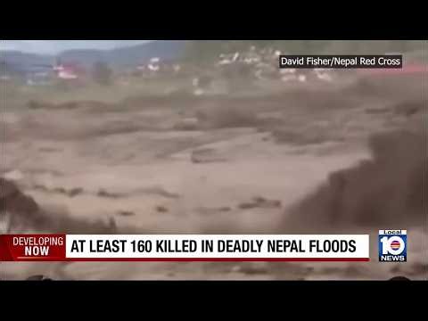 Floods caused by a glacial collapse kill at least 160 people on Nepal-China border, hundreds missing