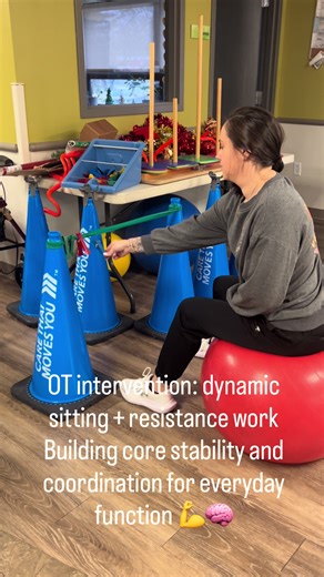 Sitting on a therapy ball while moving resistance clips from one side to the other on a Theraband is a powerful dual-task activity. This intervention targets: • Core strength & postural control • Dynamic balance • Bilateral coordination • Midline crossing • Upper-extremity strength • Motor planning By combining an unstable surface with purposeful upper-body work, we’re challenging the body to stabilize while moving—a skill needed for daily activities like dressing, grooming, reaching, and functi