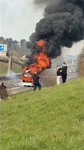 Fire engulfs bus full of soccer fans on UK highway #shorts