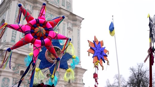 Around a thousand Ukrainians in traditional outfits marched through central Kyiv, carrying brightly decorated Christmas stars and singing carols to mark the holiday. | Reuters