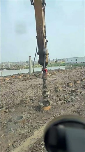 Satisfying Construction Work: Clearing Mud From Pipe Piles With An Excavator Auger Drill