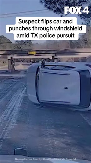 Dramatic police dashcam footage shows a suspect breaking through his windshield in a final attempt to evade to deputies after flipping his vehicle while in a pursuit in Nacogdoches, Texas. Video released here by the Nacogdoches County Sheriff’s Office shows police chasing a white SUV on New Year’s Eve before it flips over near a highway off ramp. The suspect is then seen using his arm to break through the windscreen and begins fleeing on foot. The sheriff’s office said suspect, Michael Foluso Th