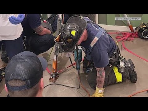 Crews rescue two people trapped in Seattle elevator