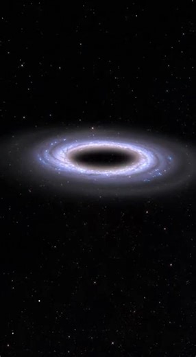 NASA Discovers Rare Ring Galaxy 612 Million Light-Years Away #Space NASA has revealed a rare and nearly perfect ring galaxy located 612 million light-years from Earth—a stunning cosmic structure unlike typical spiral or elliptical galaxies. 🌌 Ring galaxies form when one galaxy crashes directly through another, sending powerful shockwaves outward that trigger intense star formation, creating a glowing circular ring. This extraordinary discovery gives astronomers a rare glimpse into the violent a