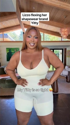 Lizzo flexing her shapewear brand Yitty