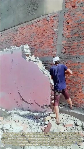 Prying Crumbling Walls: How a Simple Crowbar Brings Down Damaged Masonry Without Heavy Machinery