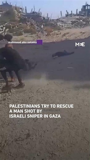 Palestinians try to rescue a man who was shot by an Israeli sniper in Gaza