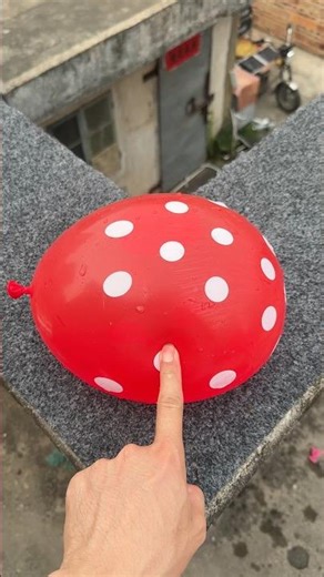 Experiment: Will a water balloon explode if it rolls down a tall building? 💥🎈 #balloon