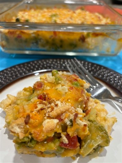Hot And Cheesy! Keeping it simple and delicious with this yummy casserole. Chicken and veggies are the stars of this recipe. It's so simple and perfect for those busy days. Feel free to change up the veggies to your preference. #dinner #chicken #Vegetables #easyrecipes | Scott & Karen