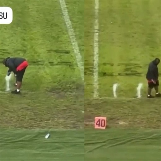 College football line painter spotted measuring field yardage lines with his feet