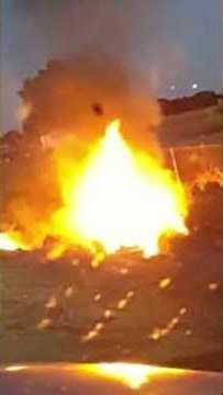 Officers rescue woman trapped in burning, overturned car