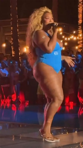 Lizzo performs at the Sports Illustrated Runway Show wearing tight swimsuit following her dramatic weight loss.