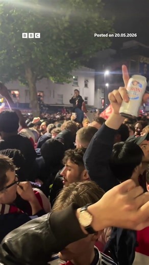 Arsenal fans celebrate after winning Premier League title